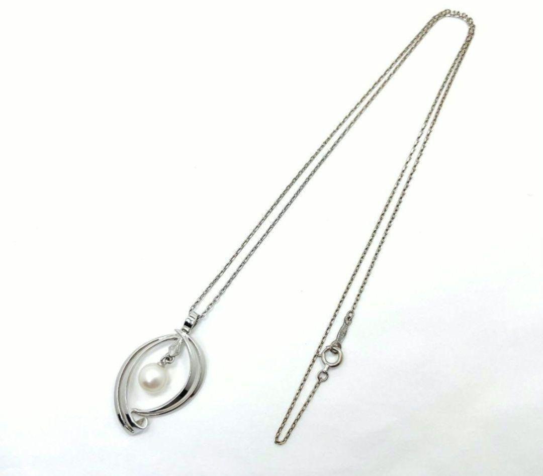 Set of four including Mikimoto silver pearl necklace, Nina Ricci necklace, Nina Ricci handkerchief, and cosmetic item