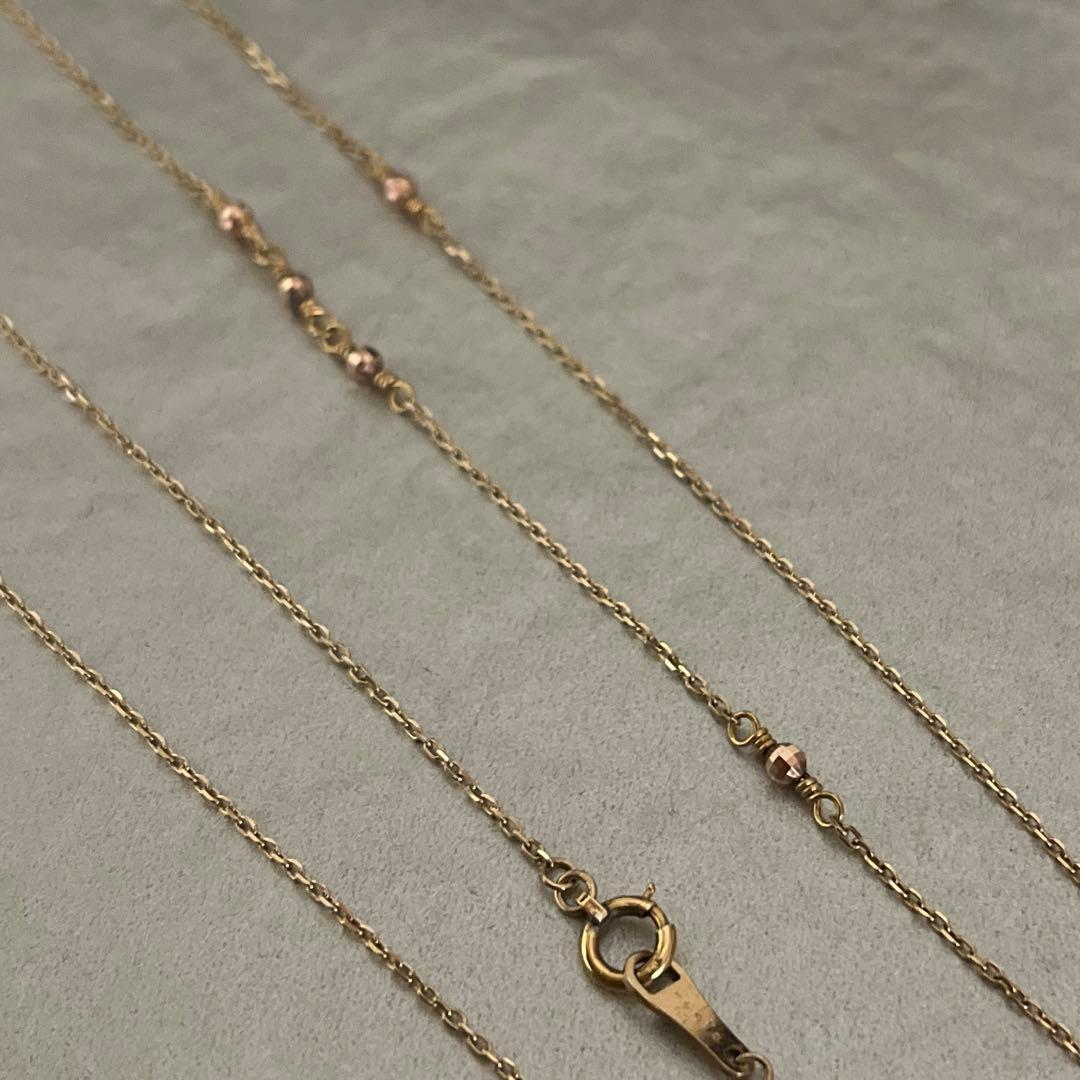 Agate K10 long necklace 40 cm with several cutpole points and faint brand engraving, gently used