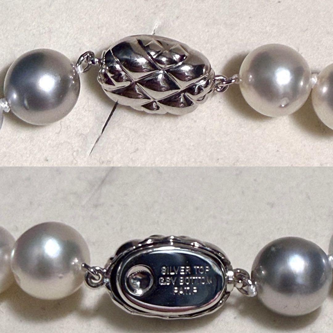 White and black pearl necklace featuring 11mm multicolor pearls with silver clasp on 44cm chain
