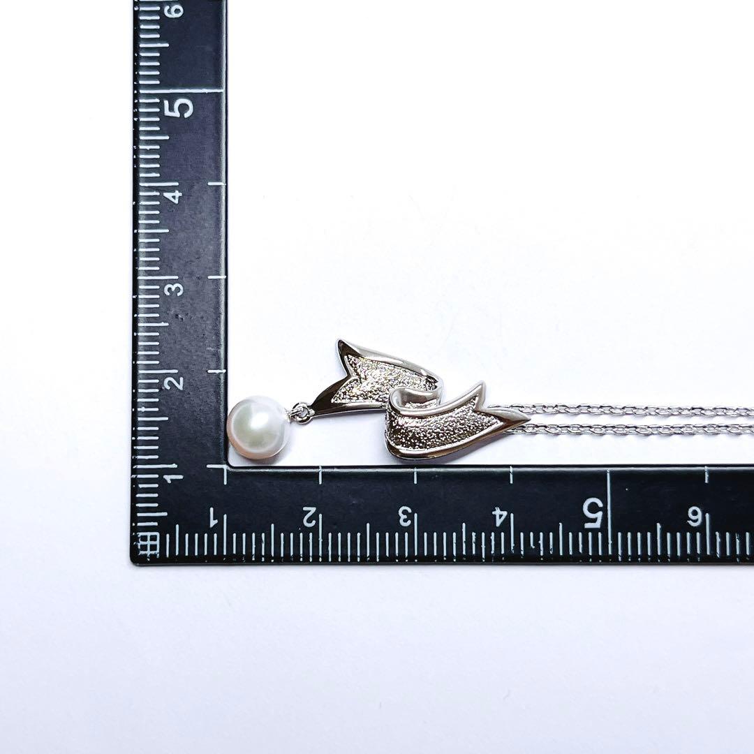 Mikimoto pearl necklace featuring 6.6mm pearls with a silver ribbon pendant on a 41cm chain