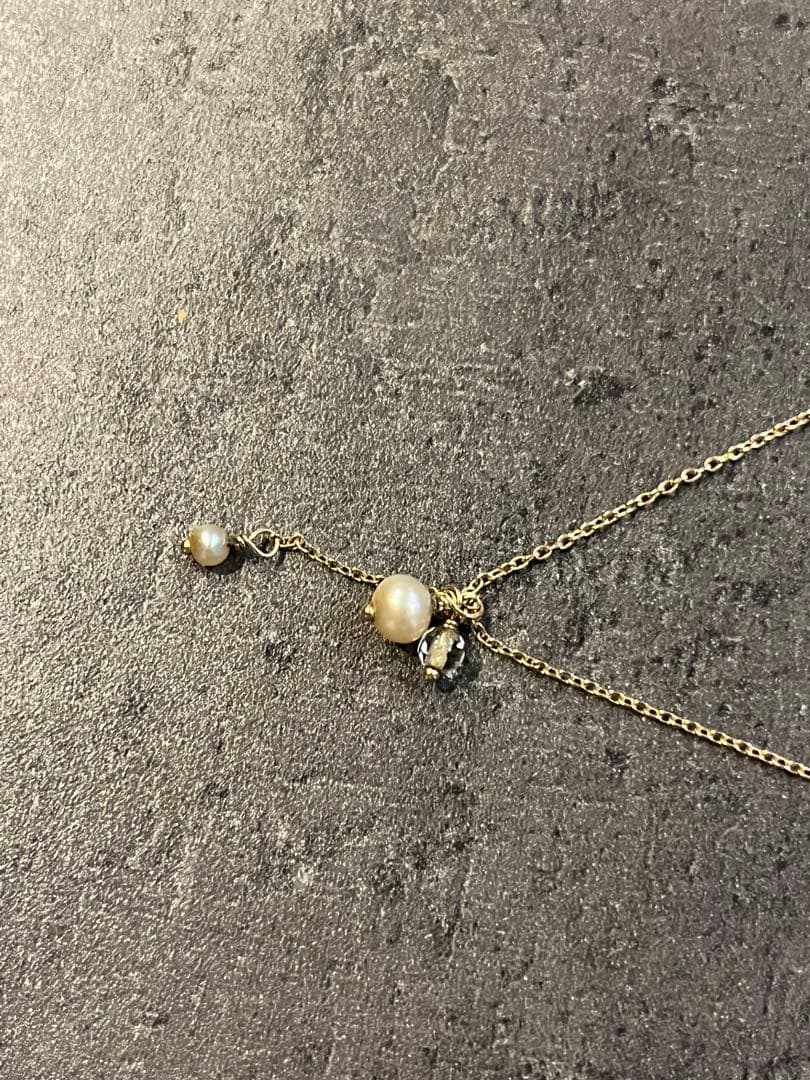 Agete Pearl Necklace in 10k gold with white pearls on a white background showing 38-42cm length