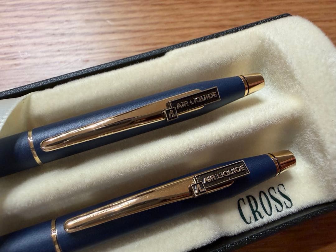 CROSS and Air Liquide branded pen and mechanical pencil set with a protective case on a white background
