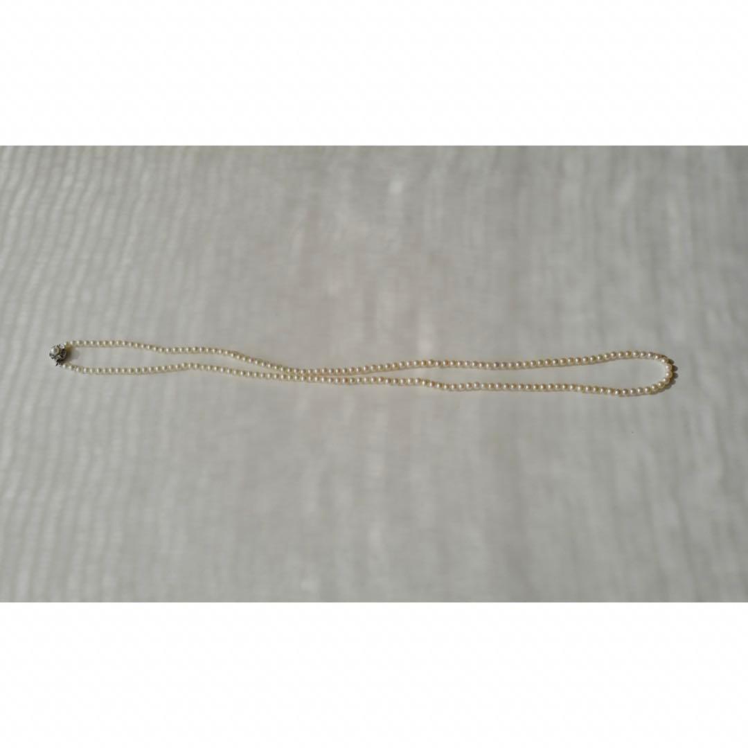 New Akoya pearls genuine baby long necklace 80.5cm with 5.0-4.0mm white pink pearls and silver fittings on display