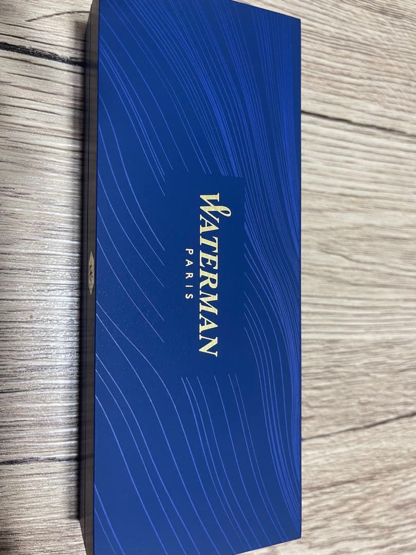 Waterman black ballpoint pen with matching case in blue box featuring gold logo