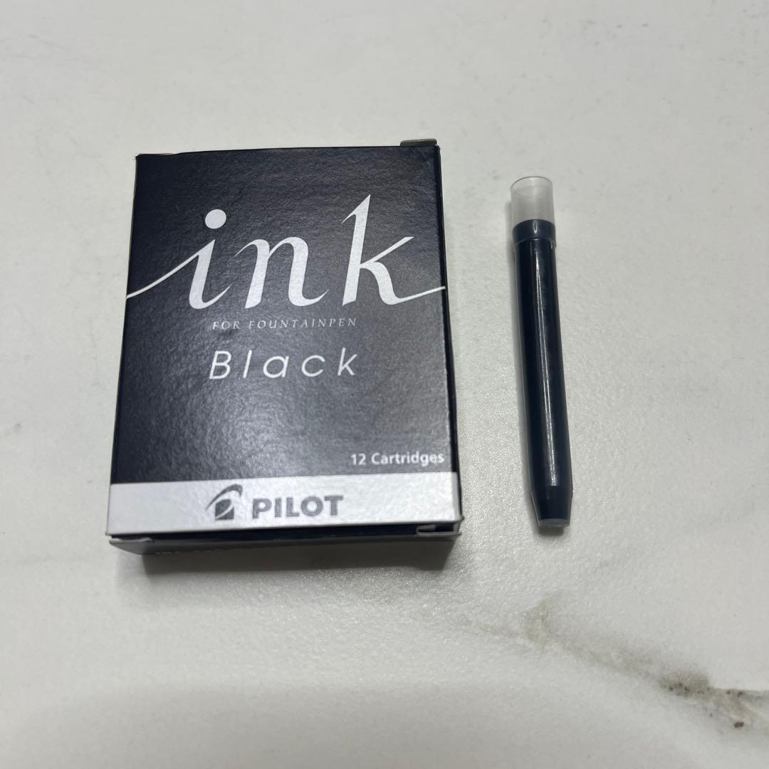 Pilot Japanese-made fountain pen with black and gold barrel and fine gold-plated nib