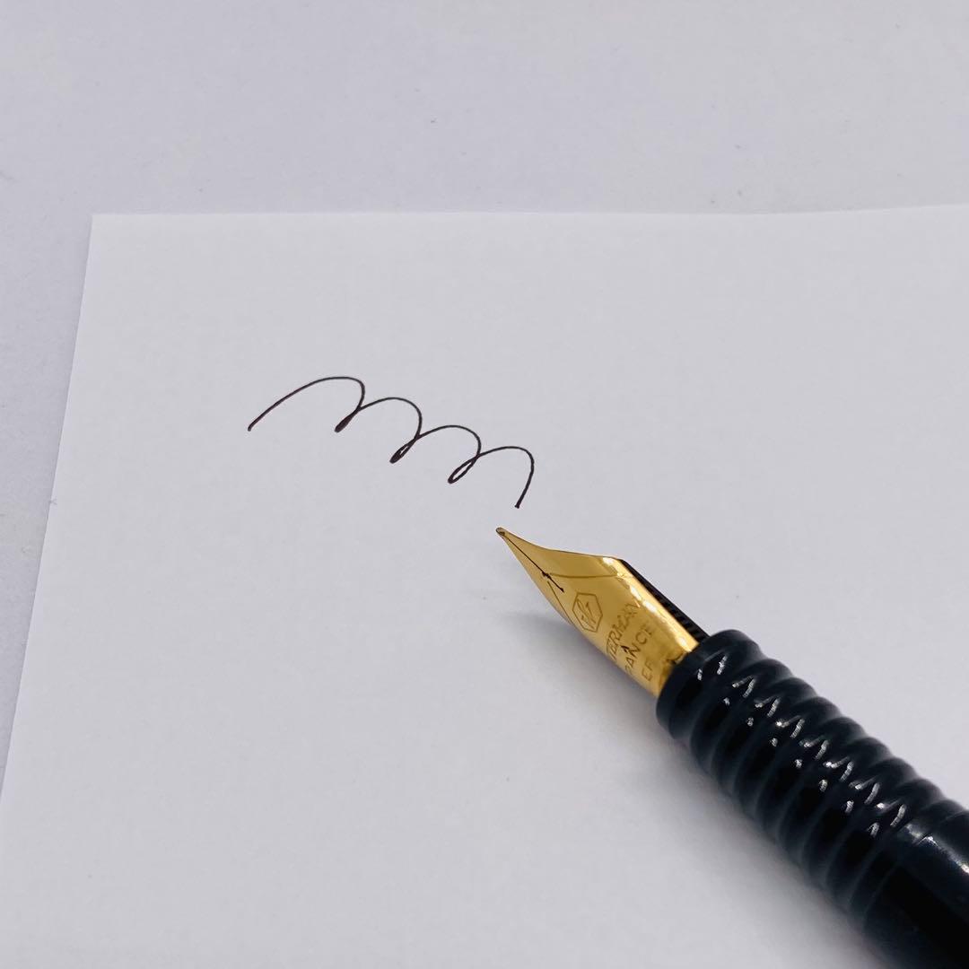 Waterman Lorea Red Marble fountain pen with extra fine nib, shown uncapped on white background