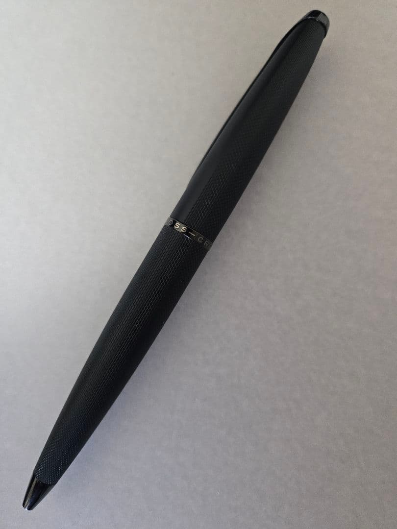 Cross black ballpoint pen with brushed metal body and twist mechanism shown