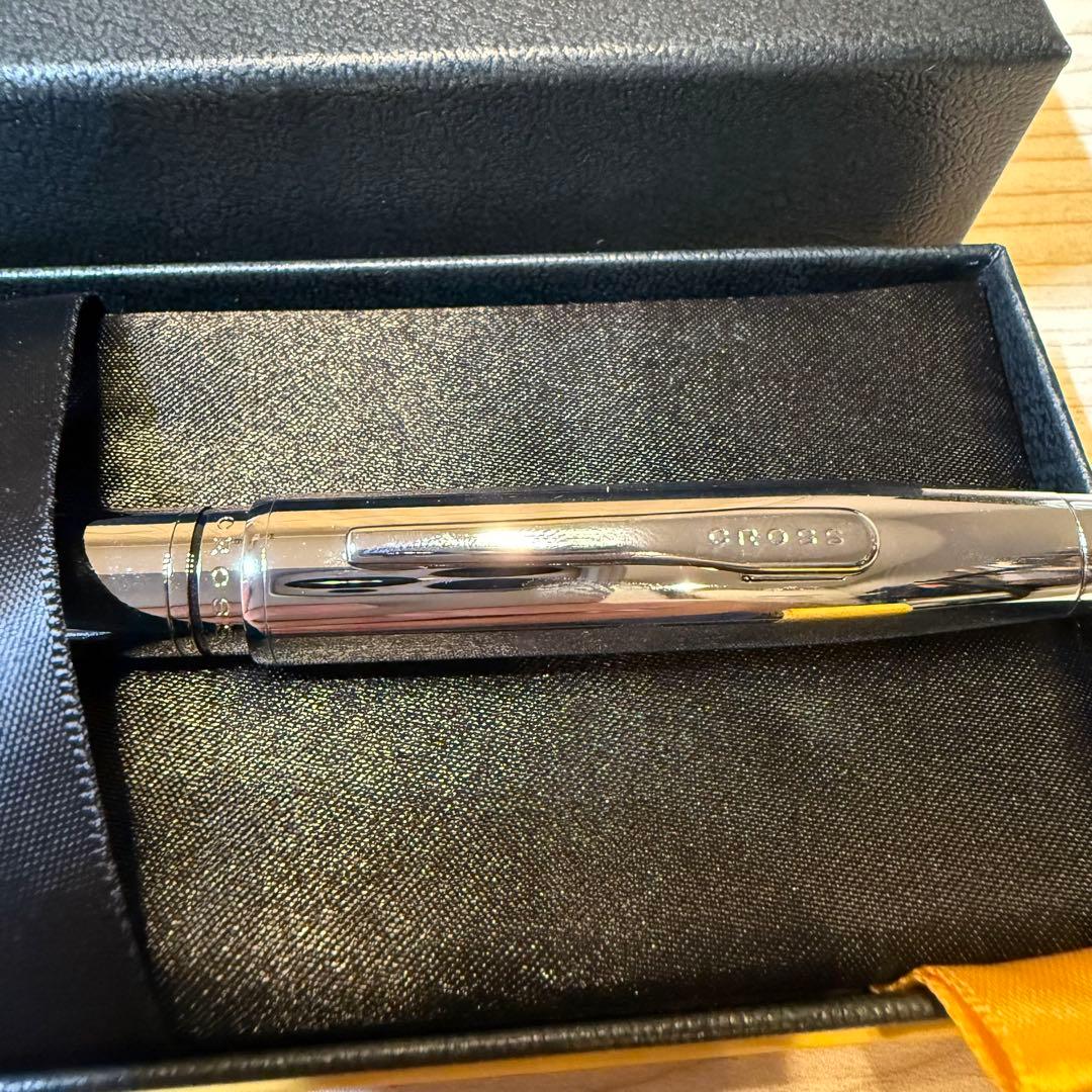 Silver CROSS ballpoint pen with a dedicated silver case displayed on a white background