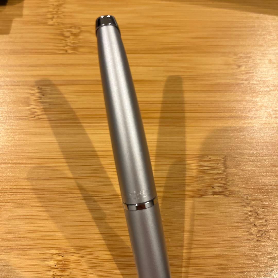 CROSS Silver Ballpoint Pen with streamlined design and matching protective case