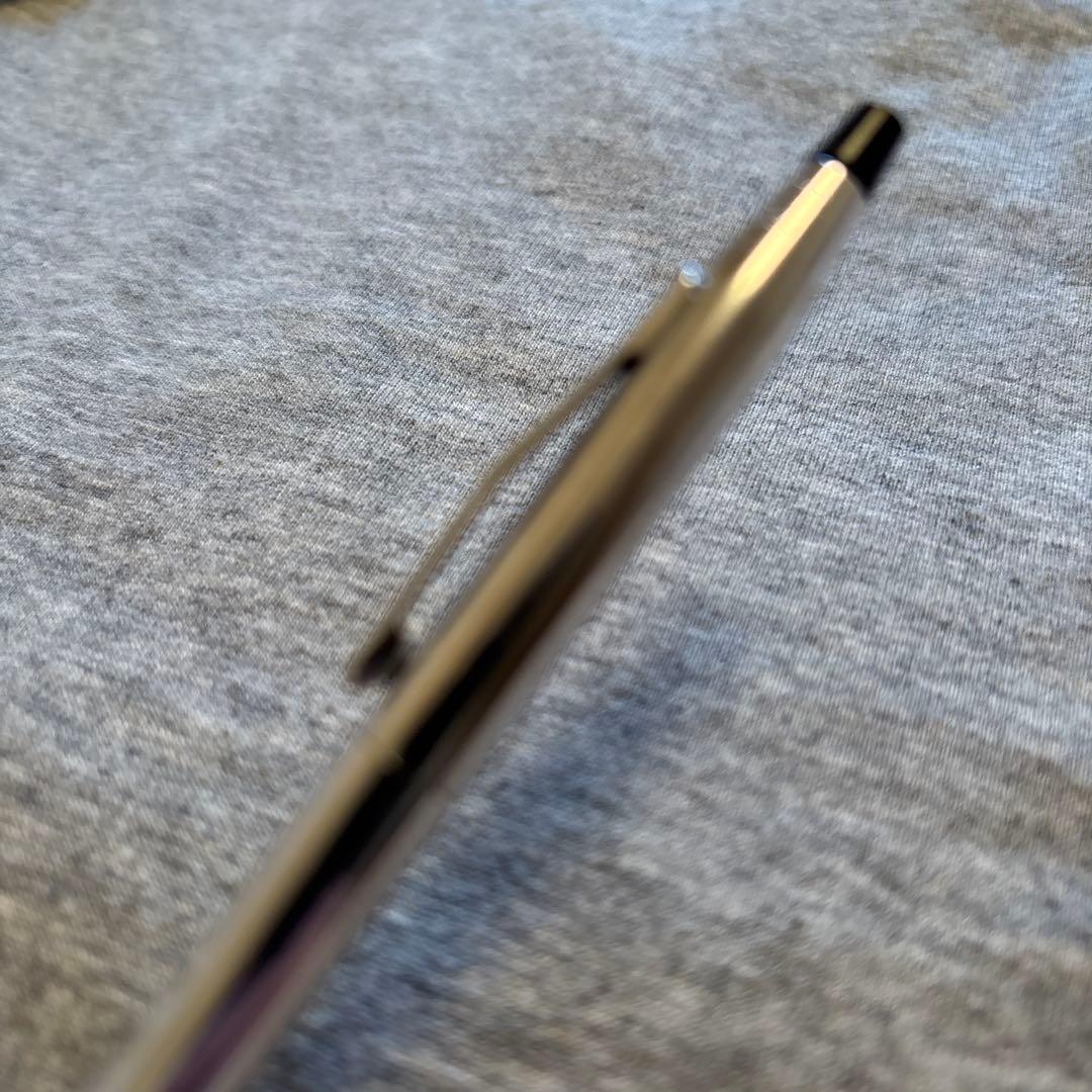 Set of two CROSS silver ballpoint pens in black and blue shown side by side
