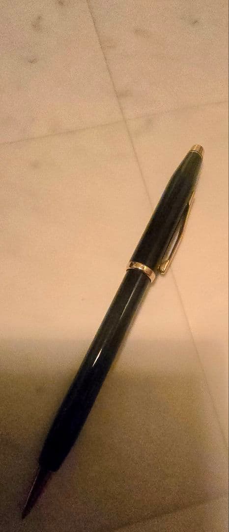Cross ballpoint pen with black body and gold trim classic century design