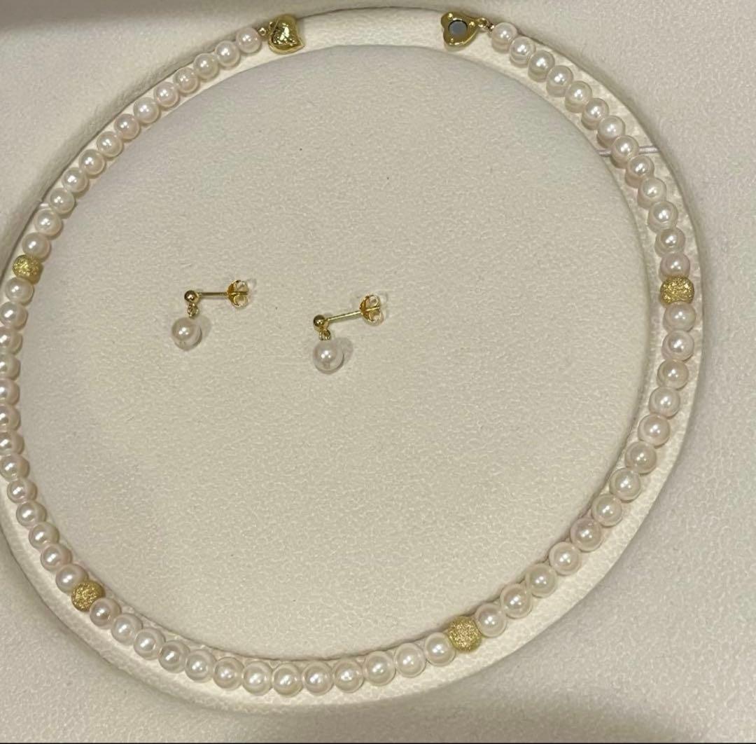 Akoya pearl necklace and matching earrings set with 5.5-6mm pearls and 40cm necklace length on white background