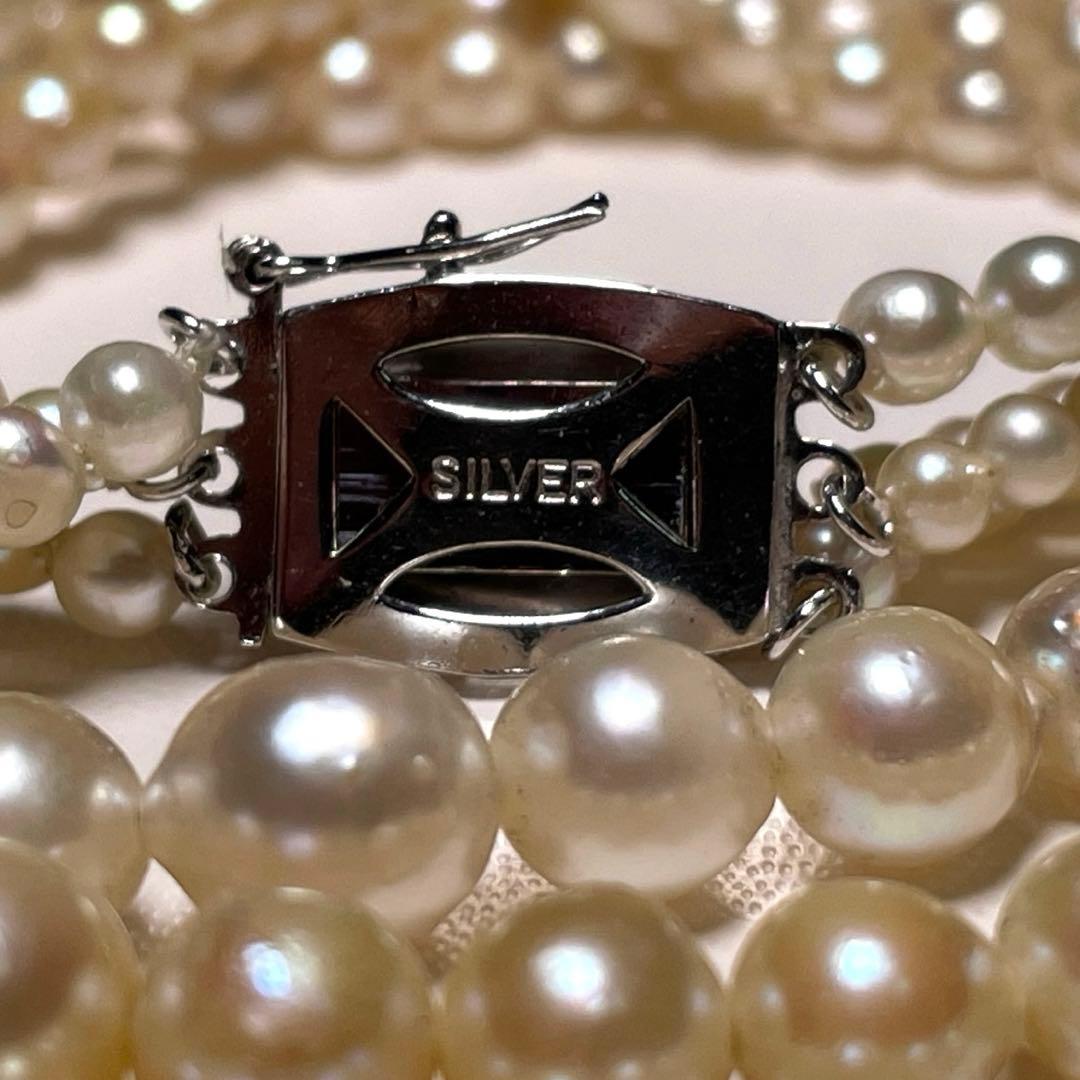 Akoya pearl triple gradient necklace with 3.4-7.3mm white semi-round pearls, 42.7cm length, silver imprint