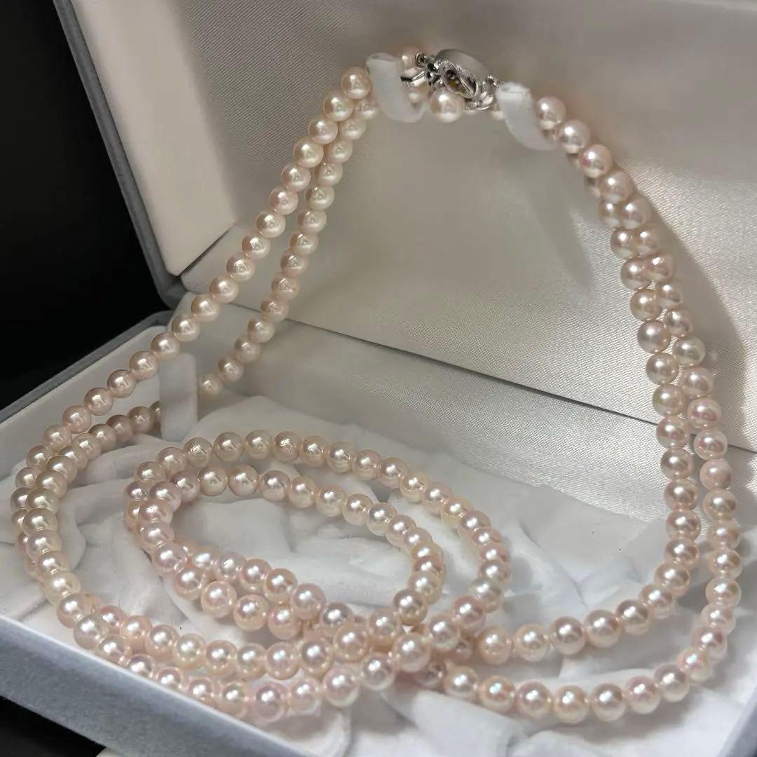 Long Akoya pearl necklace with 6.5mm pink pearls measuring 124cm with sterling silver details