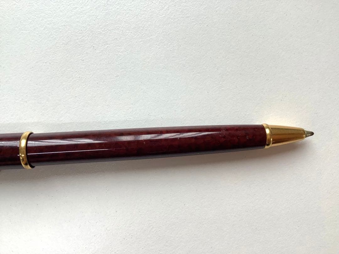 Used Waterman ballpoint pen without ink cartridge displayed on white background