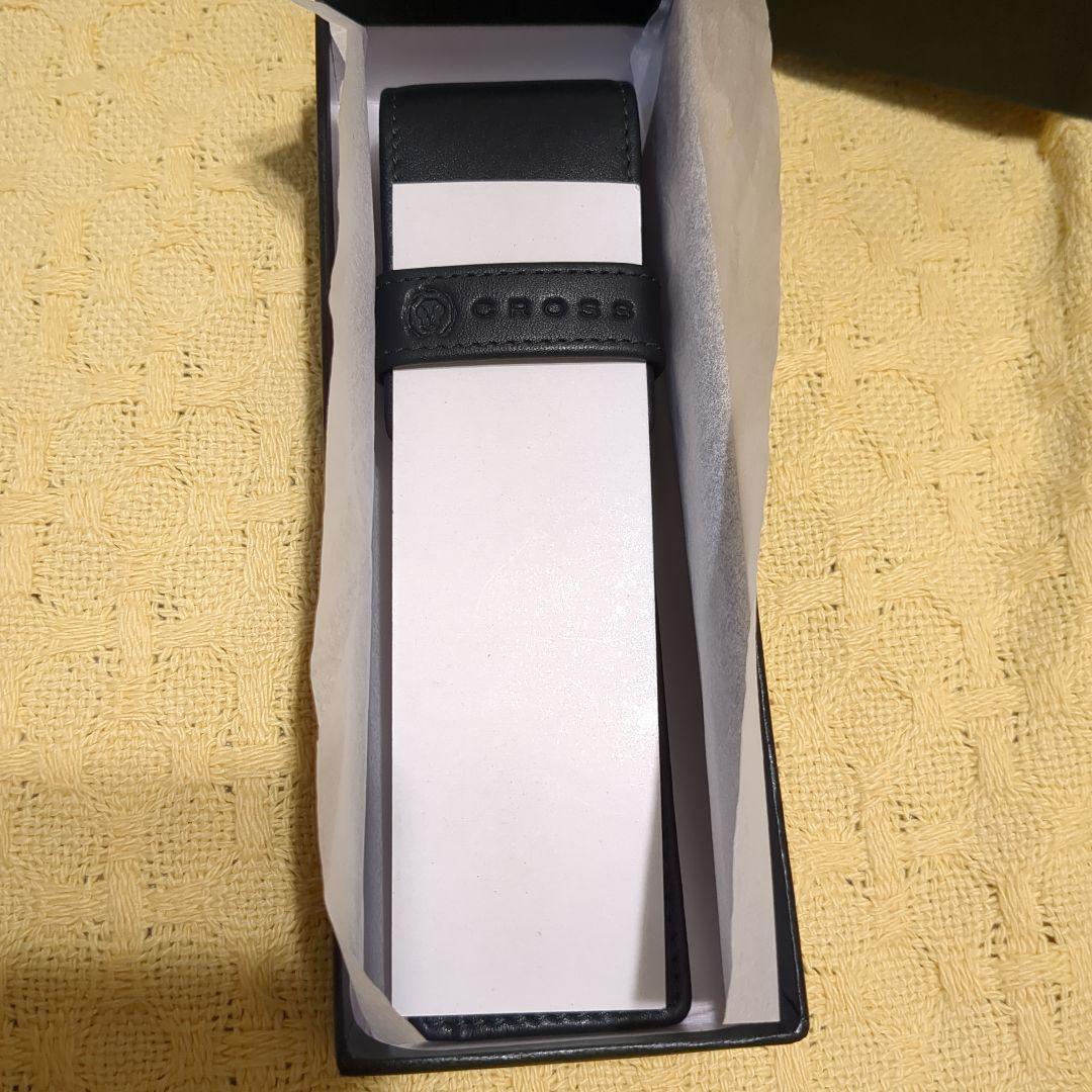 Black leather CROSS ballpoint pen case with dedicated box on white background