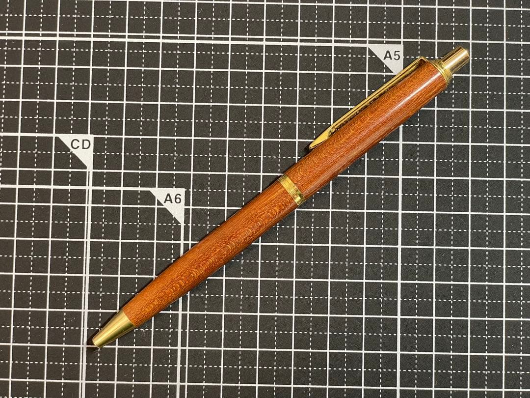 Pilot Grandee ballpoint pen with brown wooden body and gold metal accents