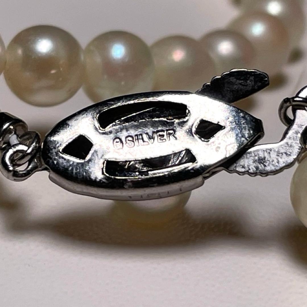 Close-up of Ise-Shima white Akoya pearl necklace with 5.4-5.9mm round pearls and silver clasp