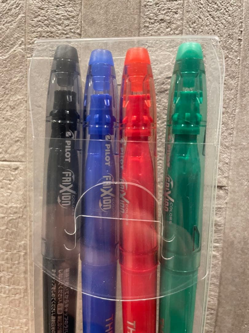 Pilot Frixion 4-color ballpoint pen set with green red blue and black erasable ink pens featuring fragment lightning bolt and convenience store logos