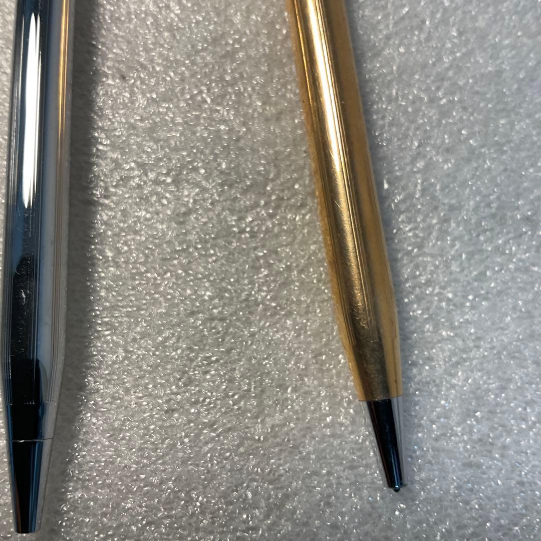 CROSS ballpoint pen 3-piece set showing three pens, two writing normally, one may need ink replacement
