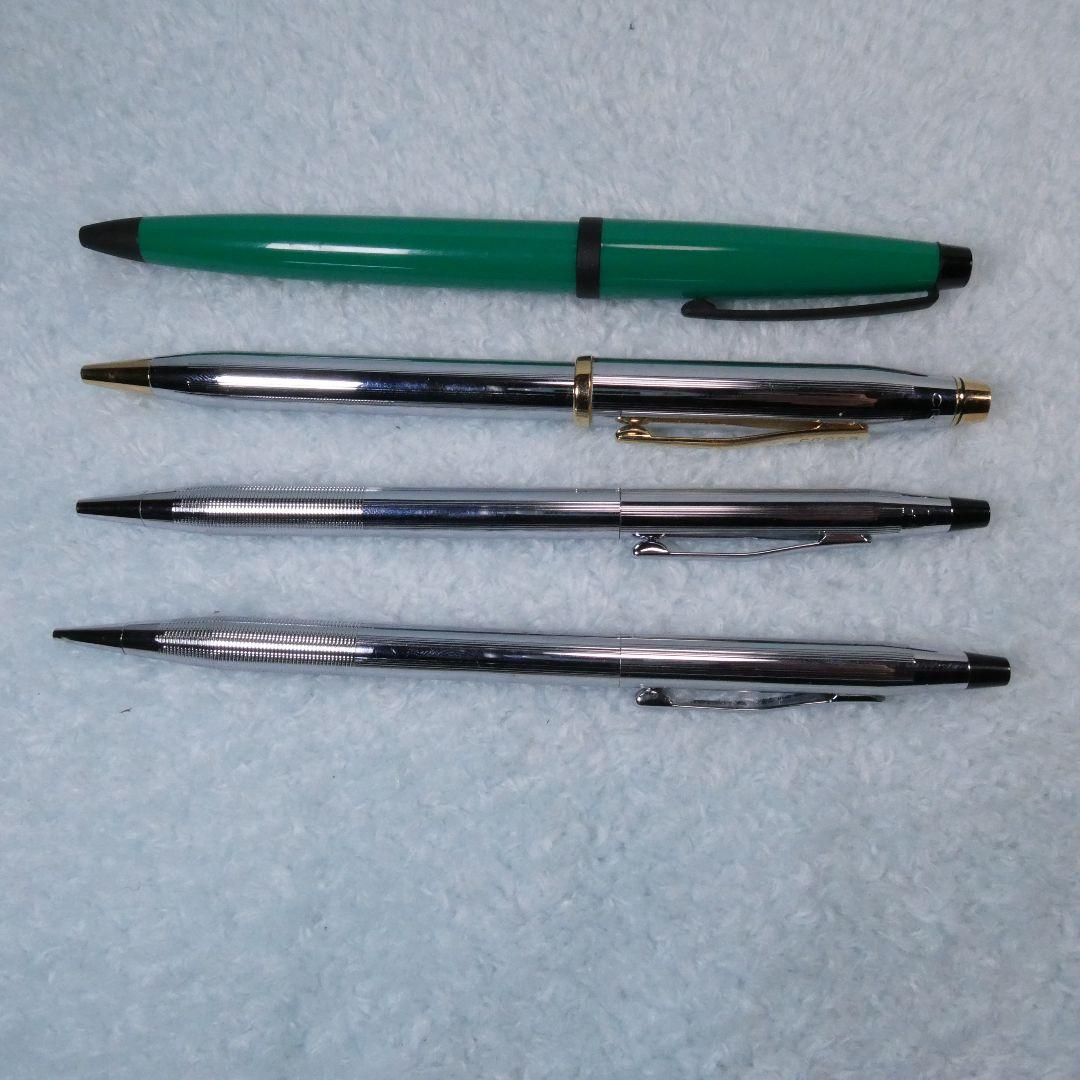 Set of four Cross writing instruments including three twist action ballpoint pens and one rotating mechanical pencil