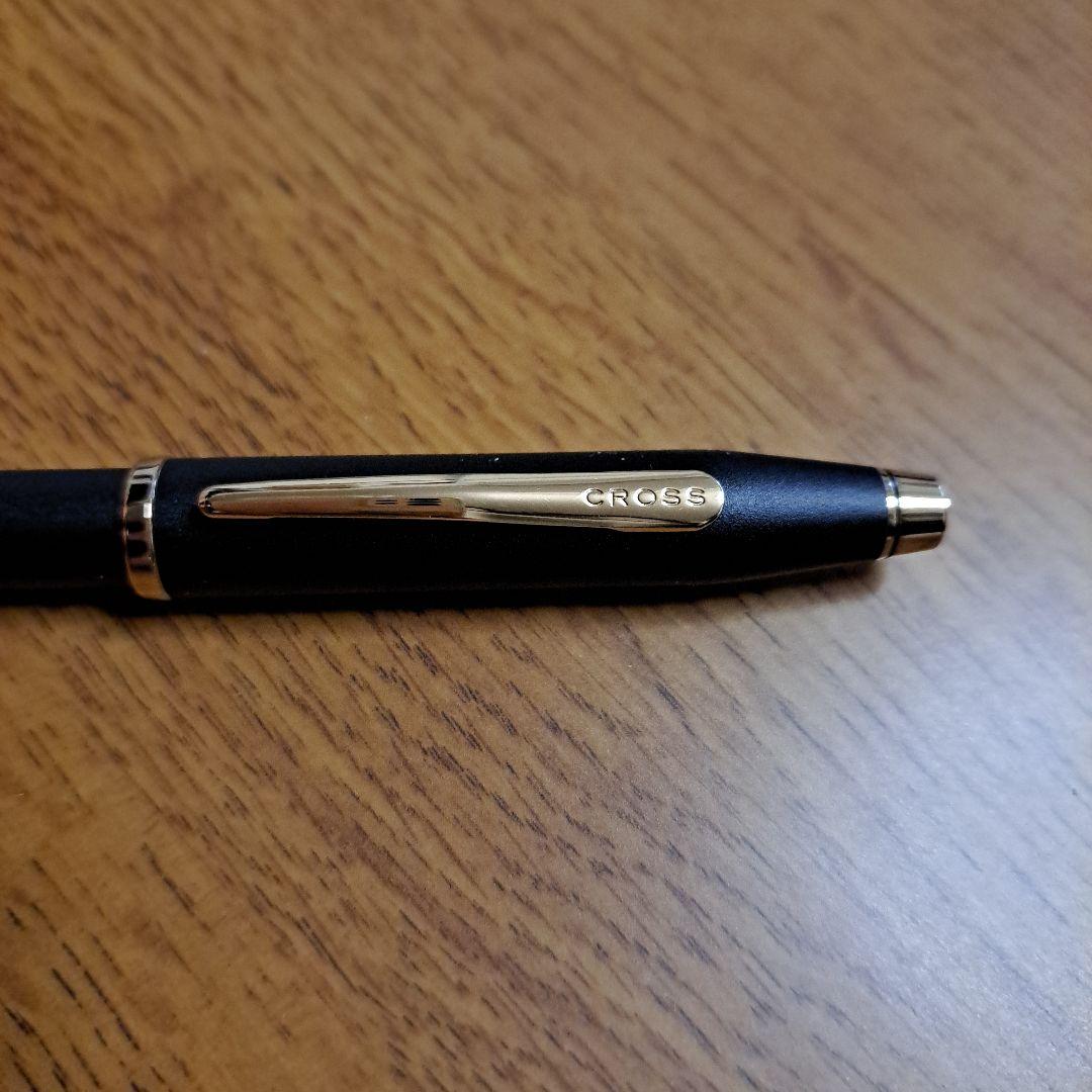 Cross ballpoint pen with silver finish measuring 13.5 cm in length and 1 cm diameter on white background