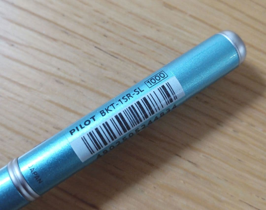 Pilot BKT-1SR-SL rotating 2-color ballpoint pen with oil-based ink in light blue barrel featuring black and red fine tips