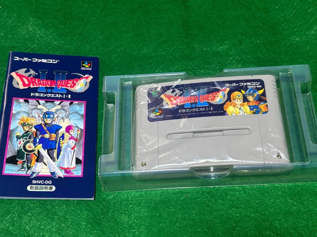 SNES cartridge of Dragon Quest I and II software with included accessories in good condition