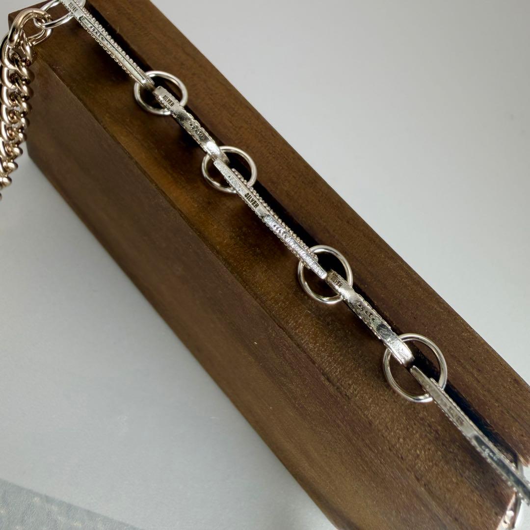 Silver plated Agat Coin Motif Necklace with a 49.5 cm length displayed on a white background