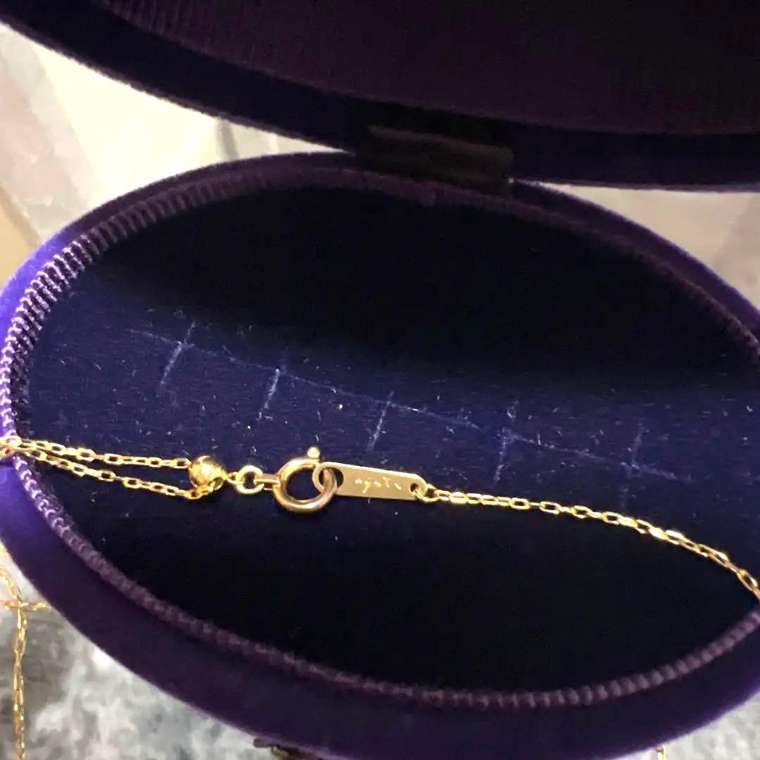 Agete K18 diamond crescent moon necklace with 48cm length displayed on a white background