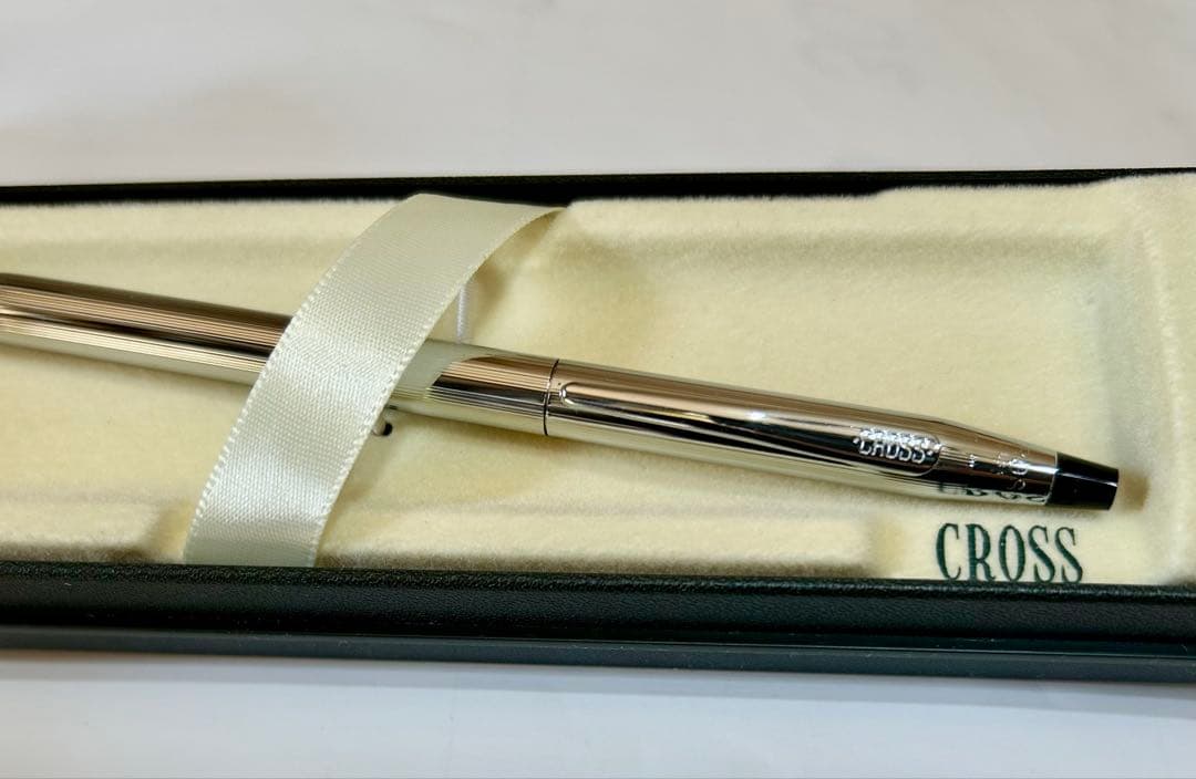 New unused CROSS ballpoint pen in original box with sleek black barrel and silver clip
