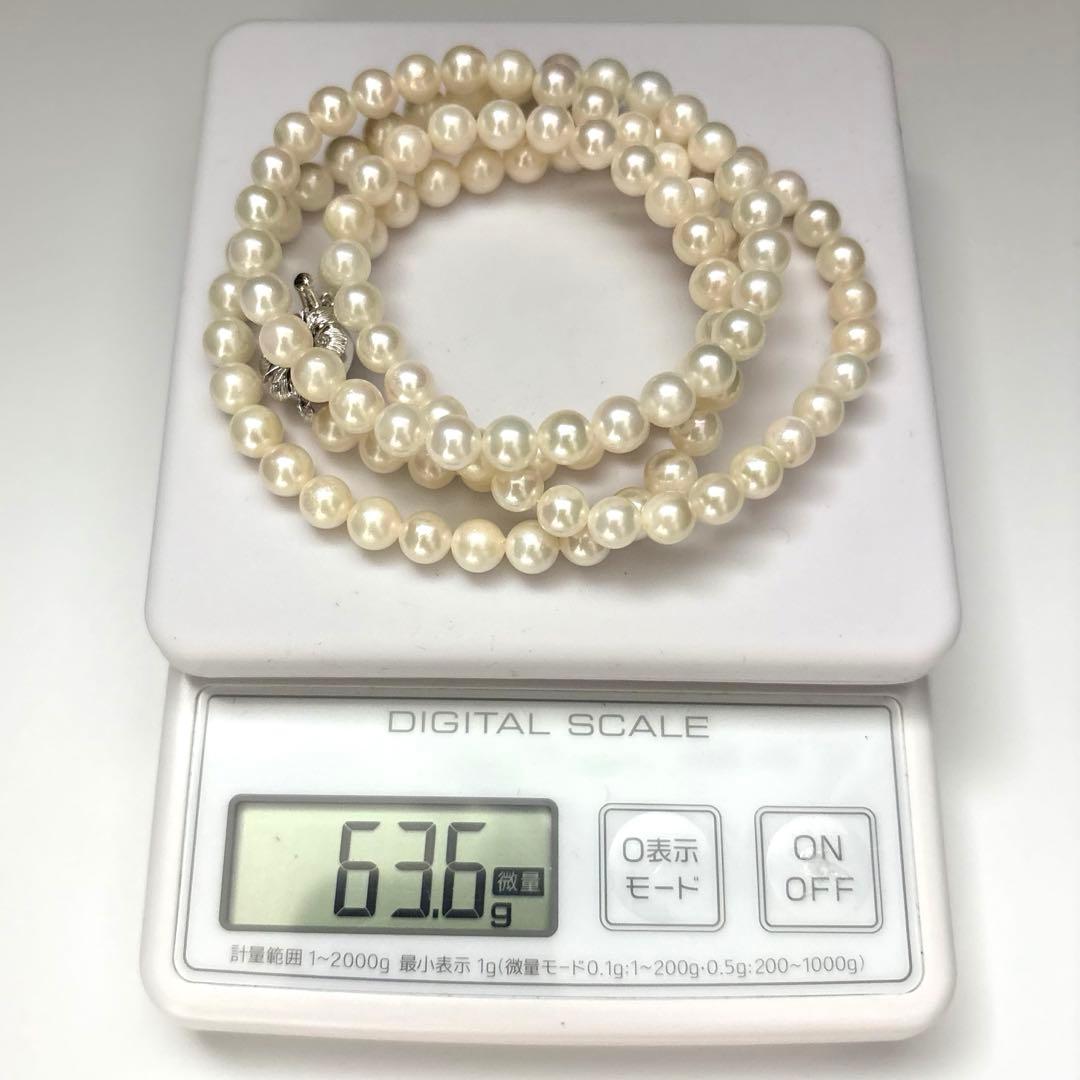 Long Akoya pearl necklace with two strands of round white pearls 7.5mm in size