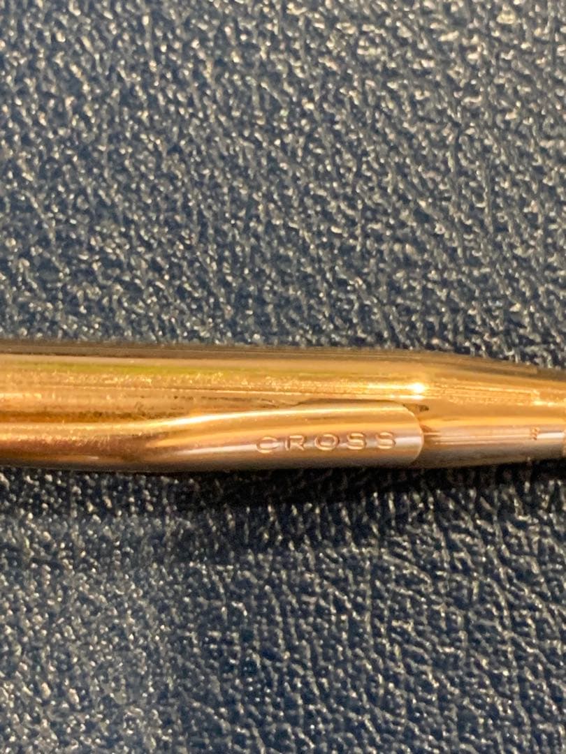 Kuro Cross Classic Century ballpoint pen with gold filled cap and barrel showing block letter logo