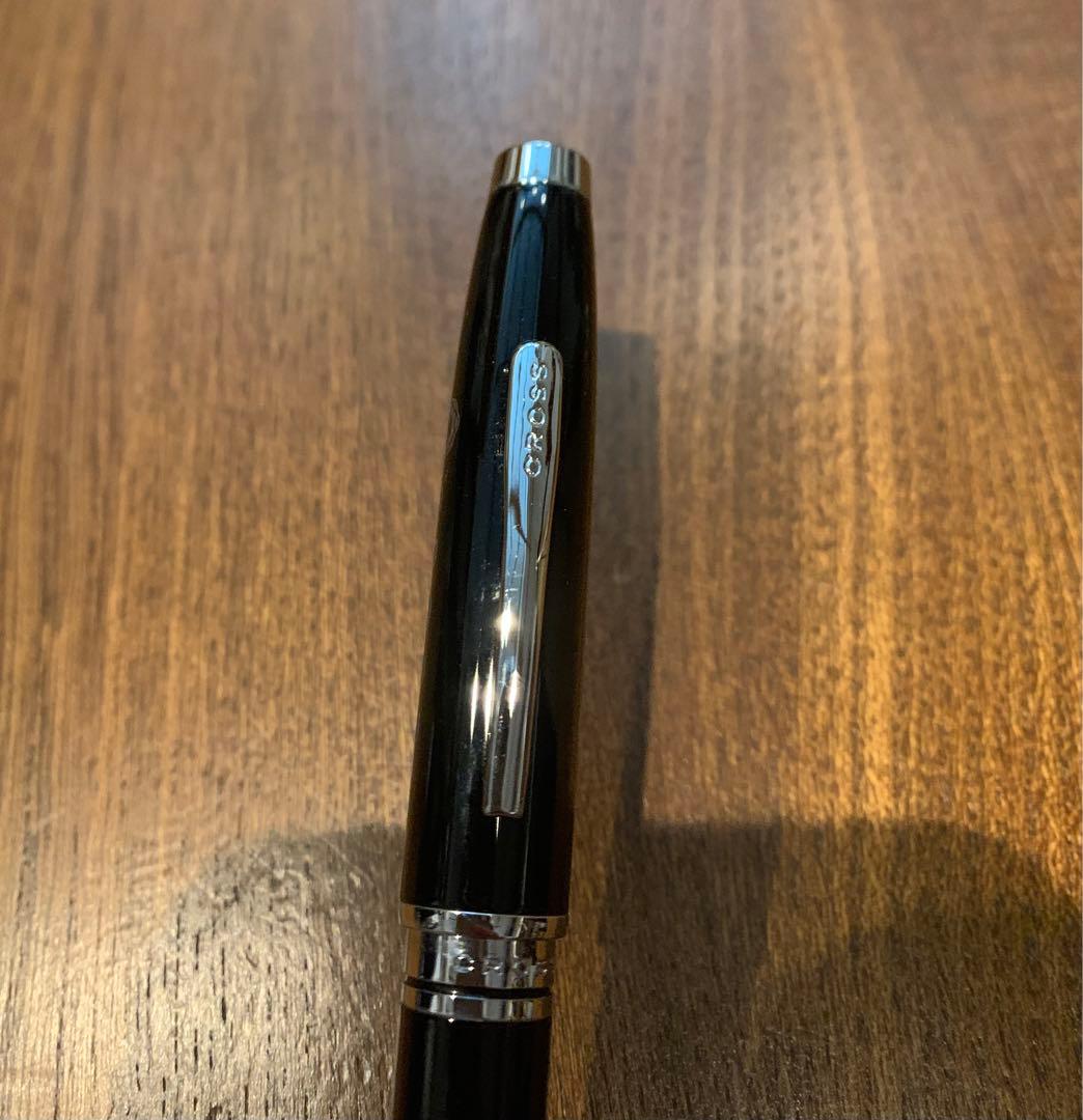 Kuro Cross Logo Pen made of plastic, 17 cm long, shown in black with cross logo design