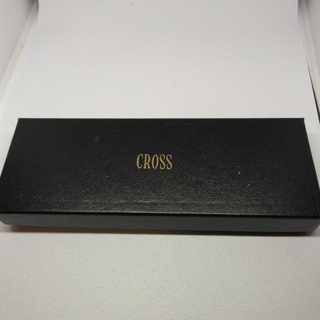 CROSS black ballpoint pen with gold accents displayed alongside its dedicated case