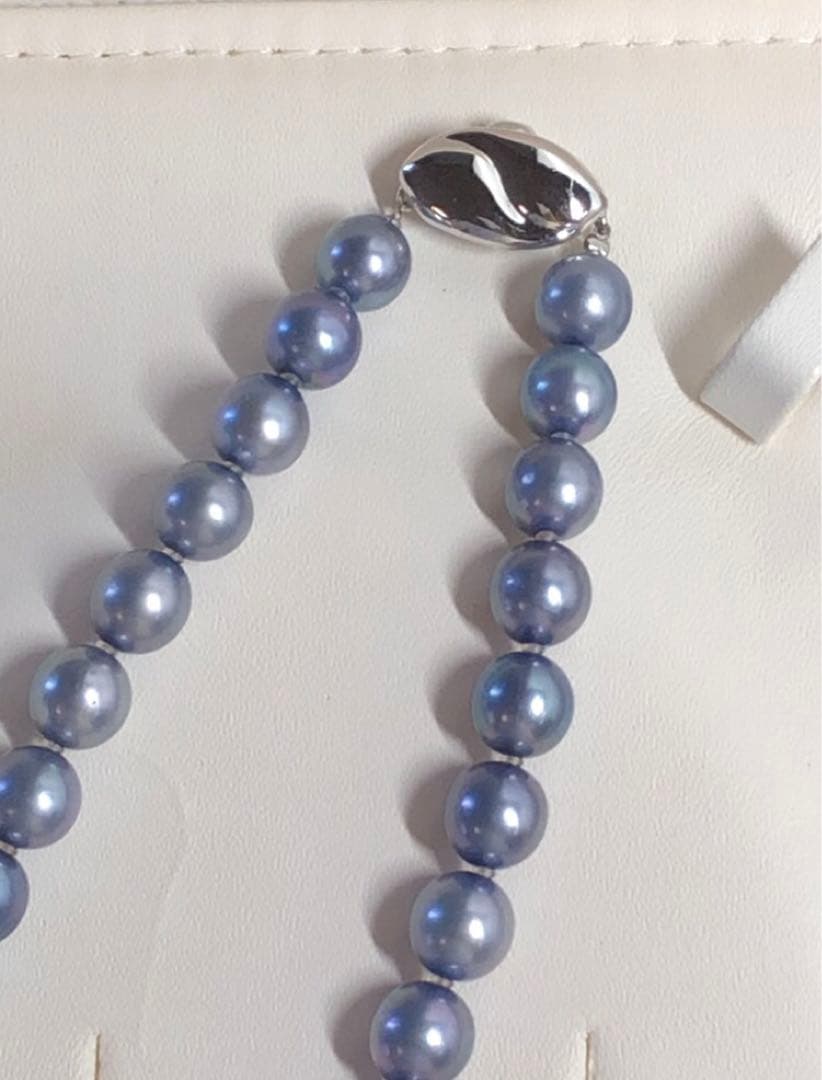 Akoya pearl necklace featuring 8mm semi-round gray pearls with blue and purple hues and silver one-push clasp