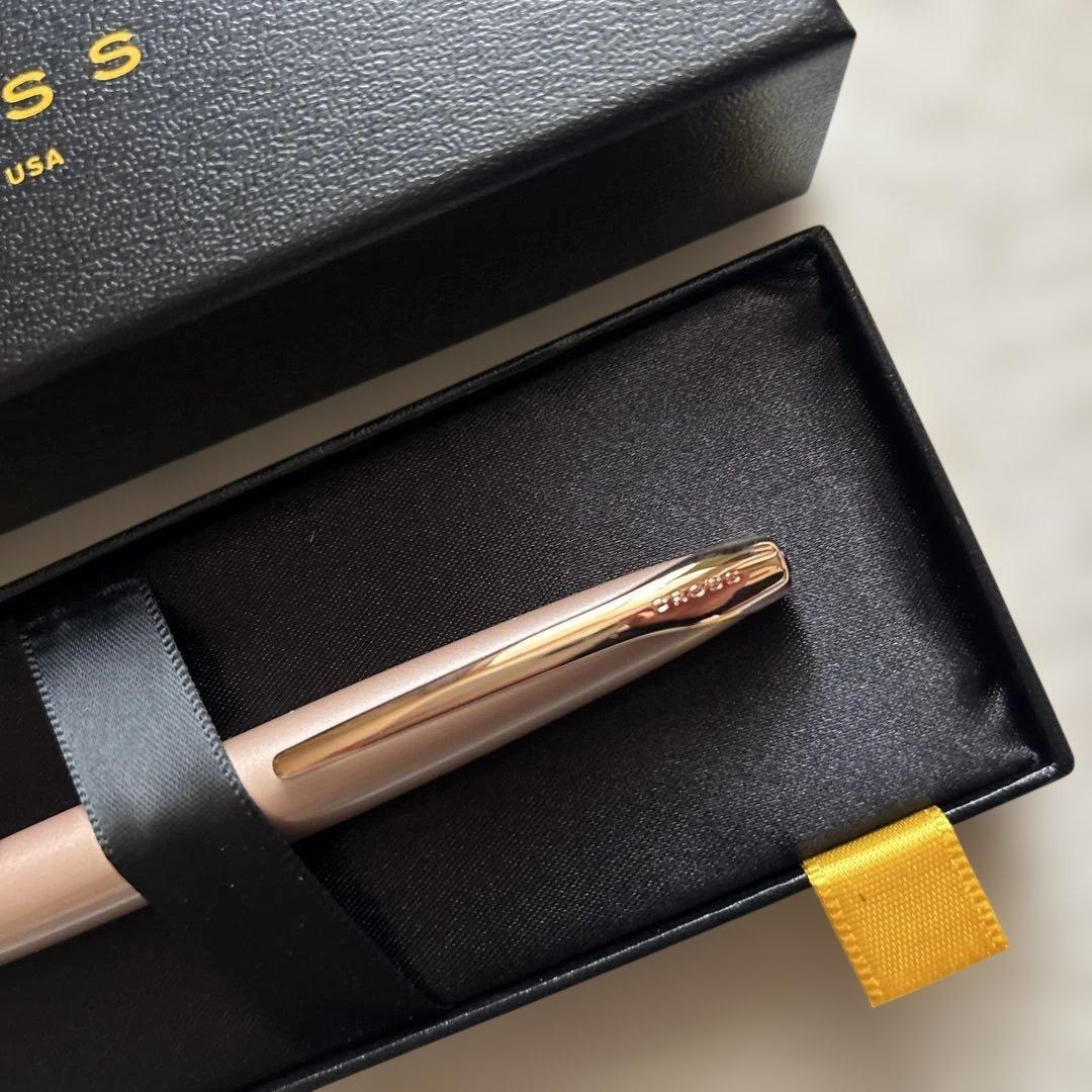 Pink gold CROSS ballpoint pen body with dedicated case displayed on white background