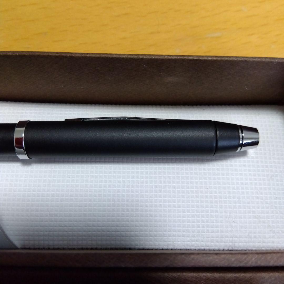 CROSS matte black ballpoint pen with chrome accents, featuring black, red ink, and mechanical pencil functions