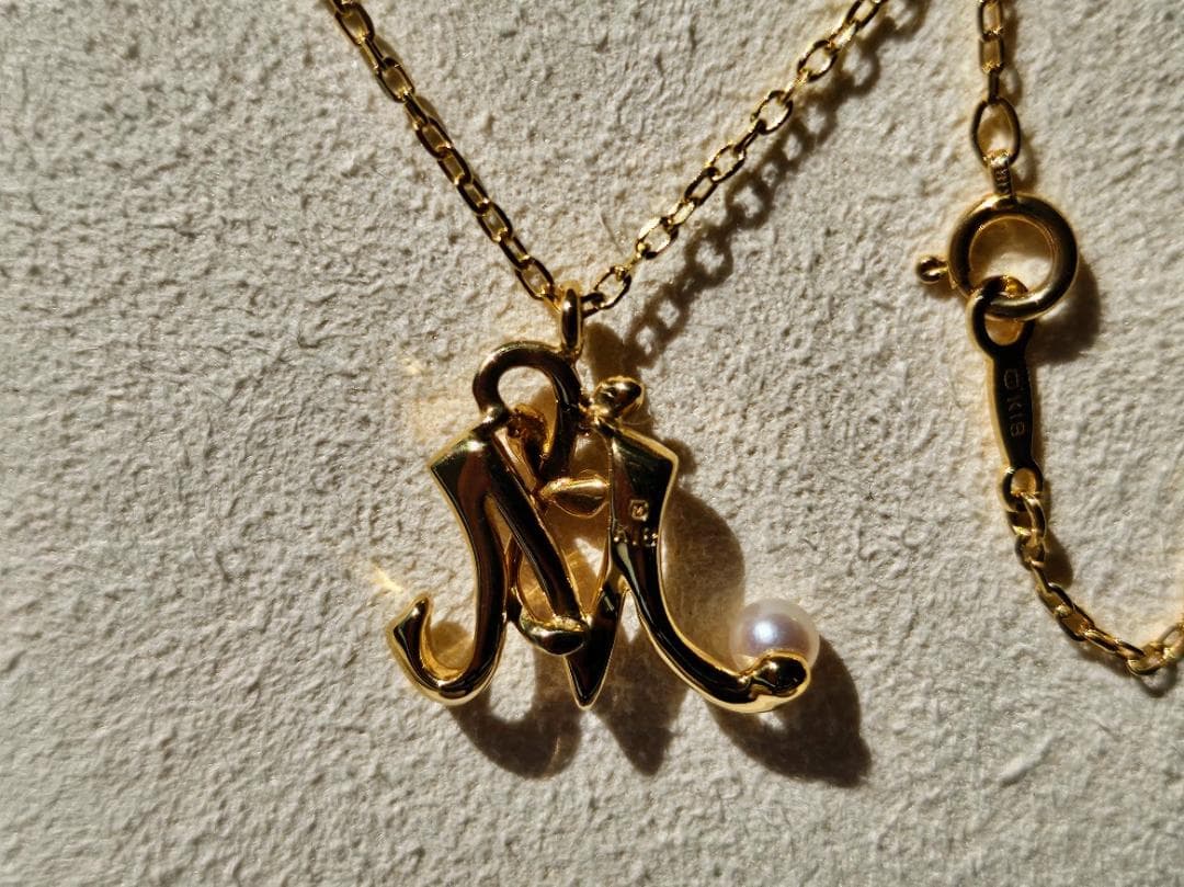 Mikimoto Baby Pearl Necklace with Initial M pendant in 18K yellow gold, 42cm chain, displayed with box