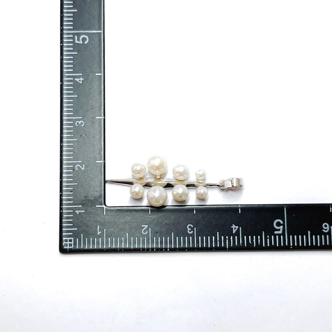 Mikimoto baby pearl necklace pendant top with silver chain and pearls sized 2.4 to 4.5 mm