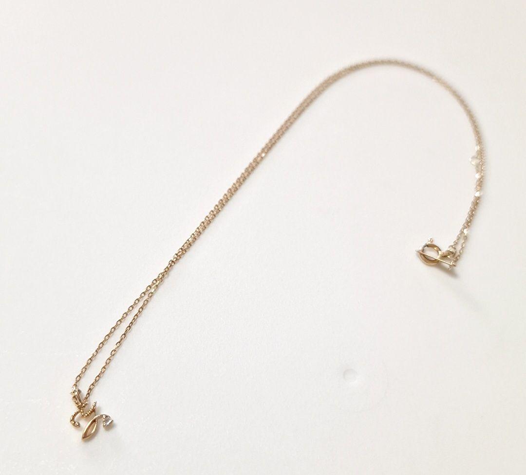 Agete K10 yellow gold necklace with diamond initial Y pendant on a fine chain