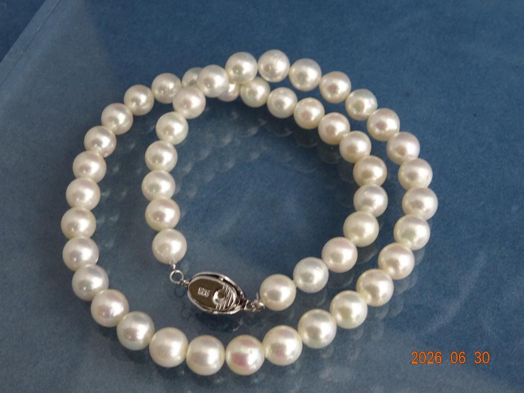 Akoya pearl necklace with 8-8.5mm white semi-round pearls showing subtle pink and cream tones