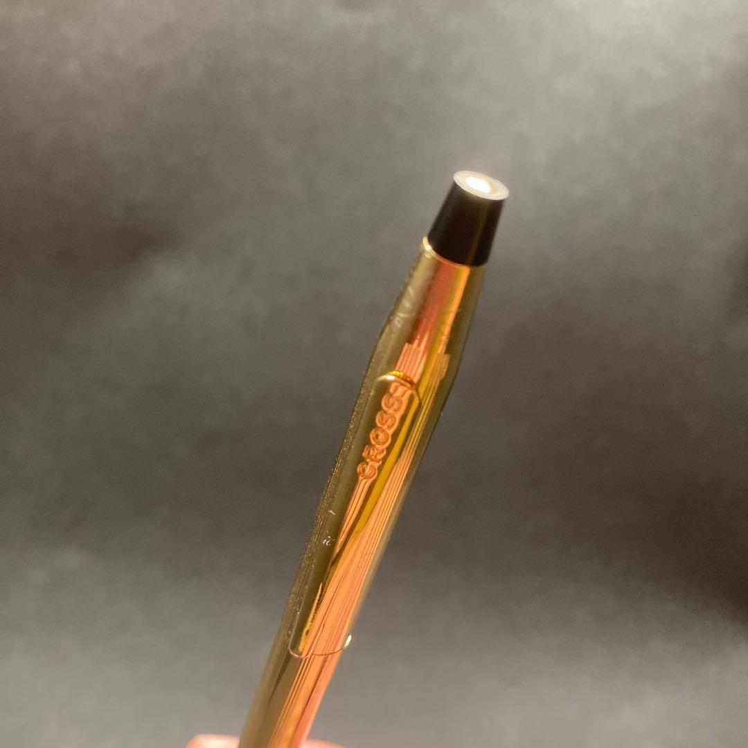 Cross Classic Century gold ballpoint pen in used condition with sleek design