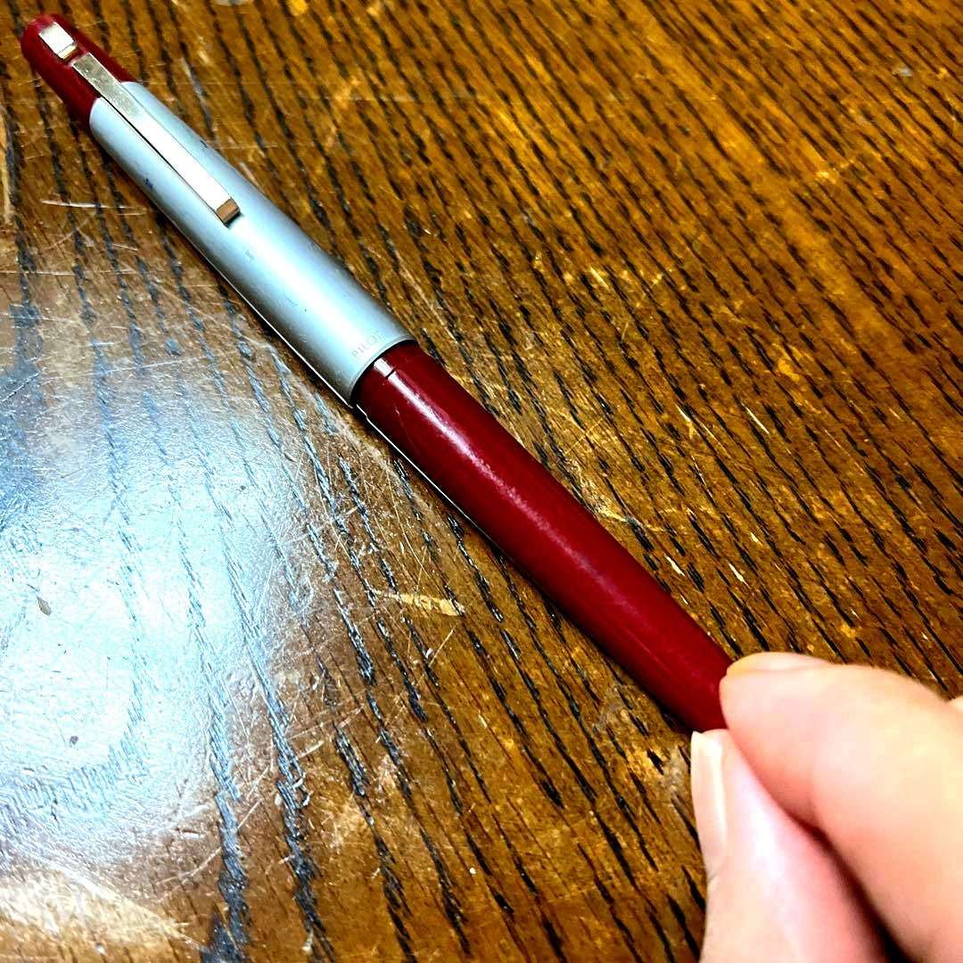 PILOT Fountain Pen with red body and silver cap shown in cap-in style