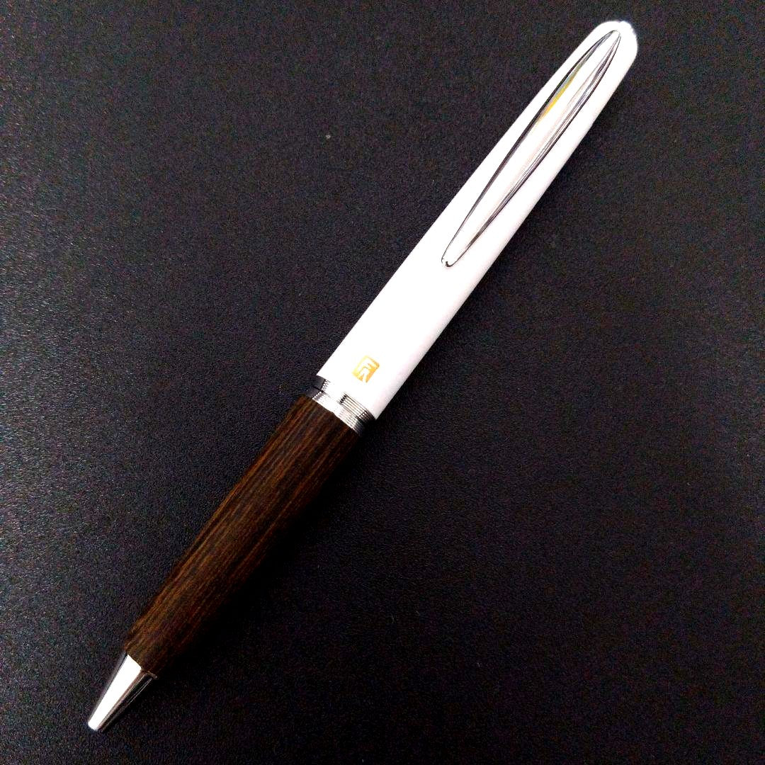 Pilot Fumi-raku white ballpoint pen with metal ceramic-like texture and resin-impregnated wood body