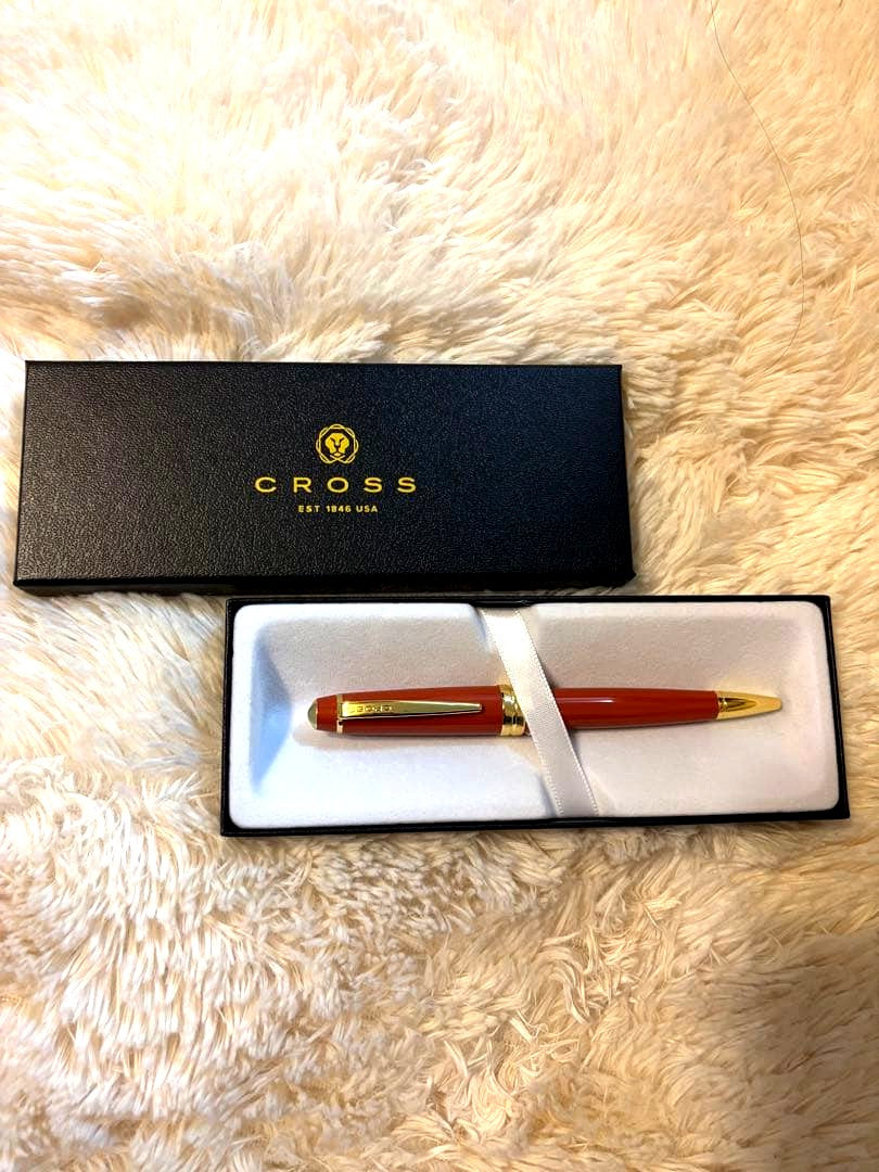 CROSS Ballpoint Pen in bright orange color, sleek design, unused condition