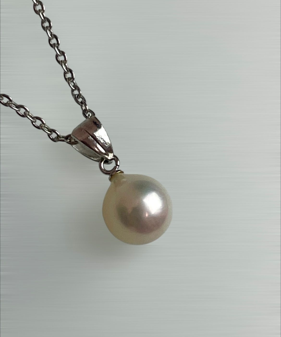 Akoya pearl necklace with a single 8.5mm white pearl on a silver chain