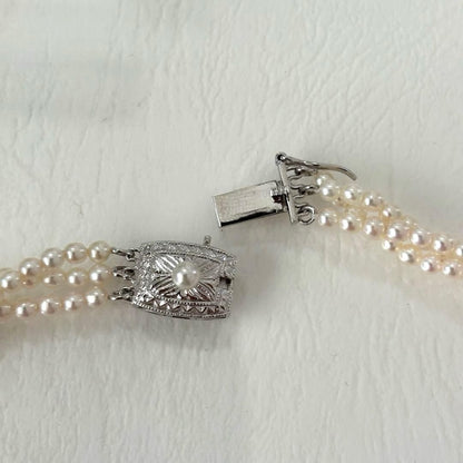 428 Tasaki silver necklace with three rows of approximately 2.7-2.9mm pearls and silver clasp