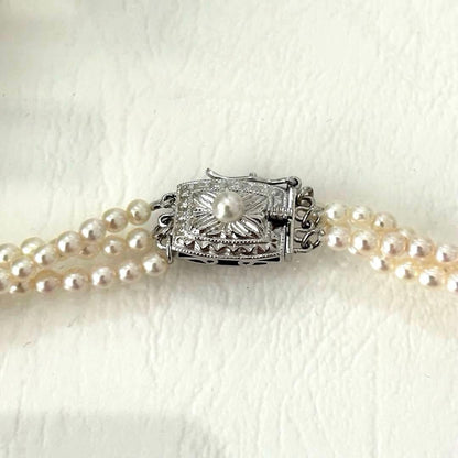 428 Tasaki silver necklace with three rows of approximately 2.7-2.9mm pearls and silver clasp