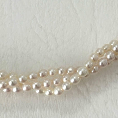 428 Tasaki silver necklace with three rows of approximately 2.7-2.9mm pearls and silver clasp